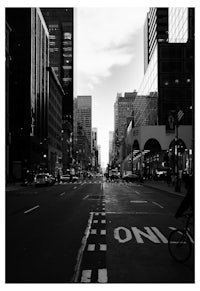 a black and white photo of a city street