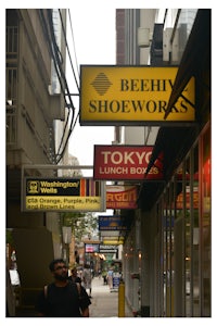 a man walking down a sidewalk