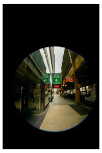 a picture of a street with a sign on it