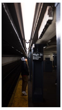 a man standing in a subway station