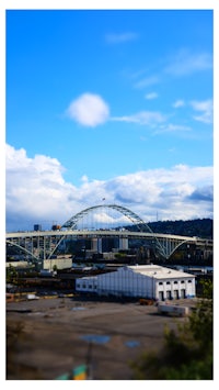 a blurry image of a bridge over a city